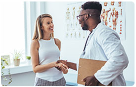 woman with primary care doctor